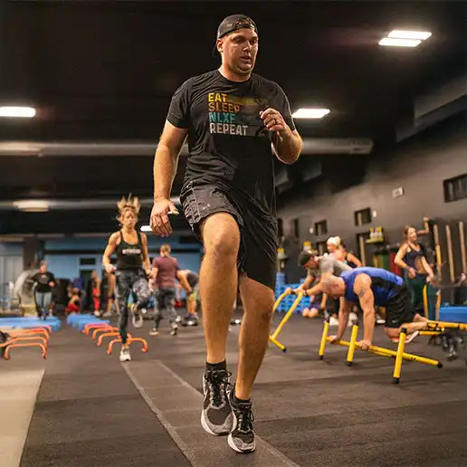 During an NLXF class, participants perform a variety of workouts out at different stations around the gym